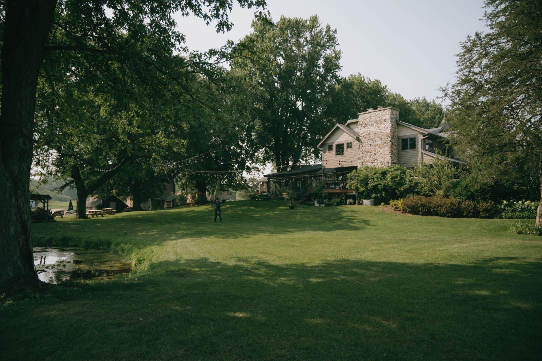 A larger Owings lot with mature trees and a nearby creek — the moisture and shade pests favor