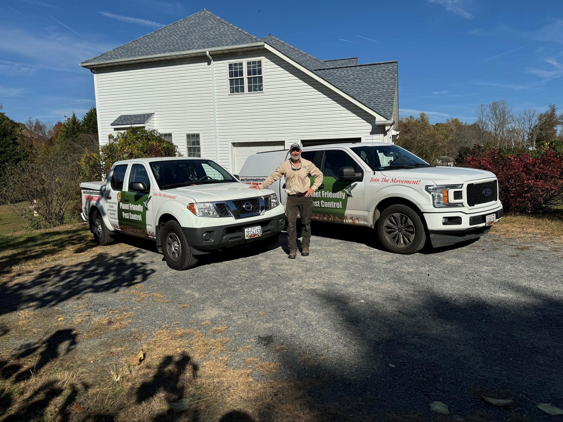 Planet Friendly Pest Control's branded service trucks and owner at a Northern Virginia home — the local team behind every visit