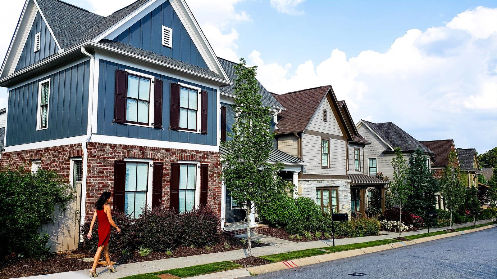 A Southern Maryland home with landscaped beds and lawn — where pest pressure begins in the surrounding landscape