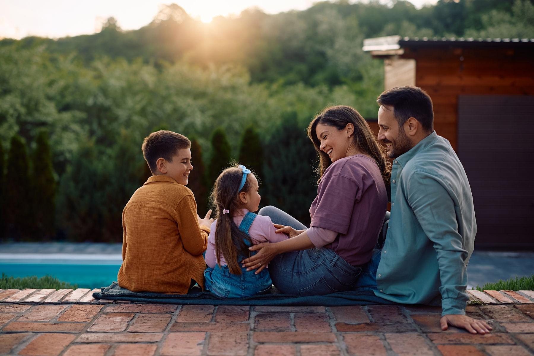 A family relaxing in their pest-free backyard