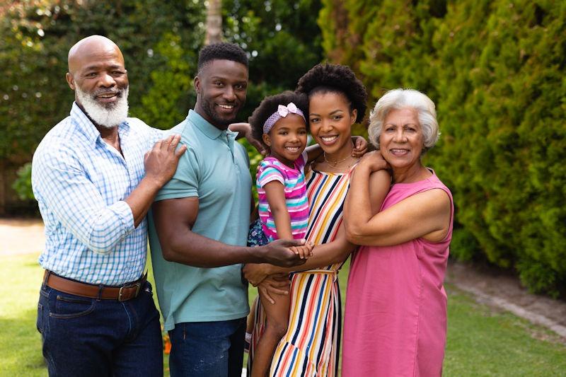A multi-generational family enjoying their pest-free backyard